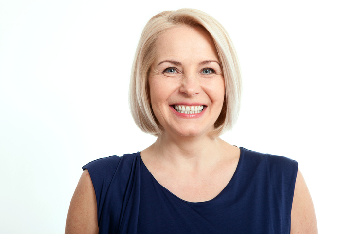 Friendly Smiling Middle Aged Business Woman Isolated On White